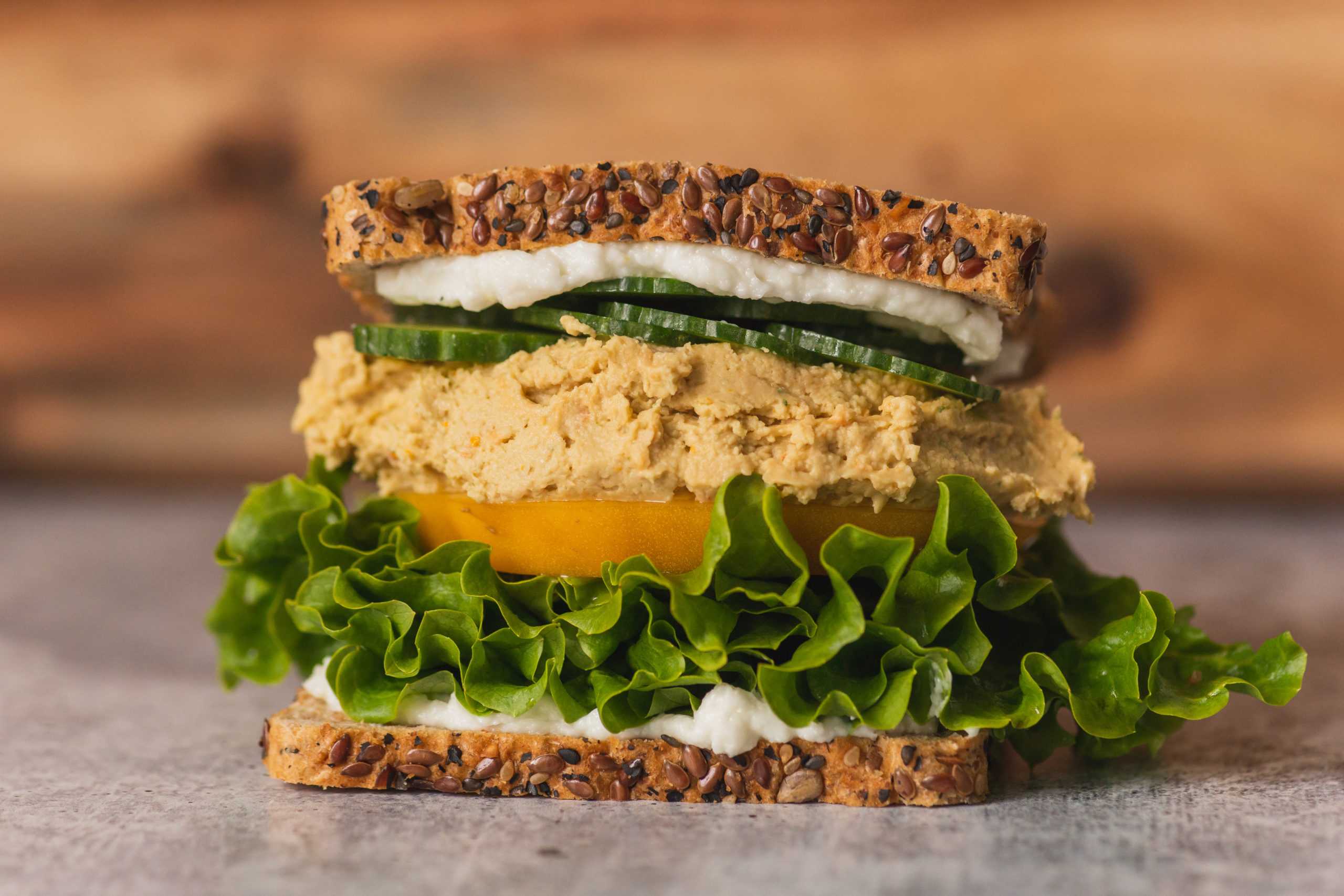 Trazza Foods Vegan hummus & toum garlic sauce in healthy sandwich.